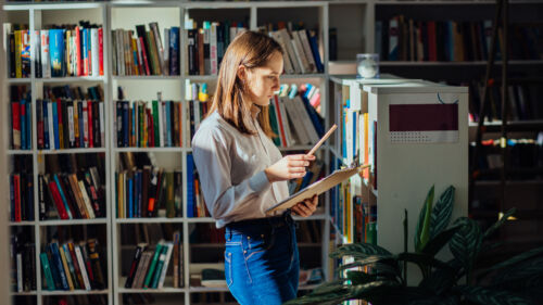 Student,In,Library,-,Smiling,Young,Female,Teenager,Search,A