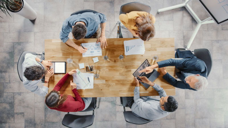 Startup,Meeting,Room:,Team,Of,Entrepreneurs,Sitting,At,The,Conference
