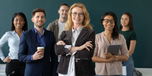 Happy,Senior,Businesswoman,,Diverse,Business,Team,Leader,Posing,With,Multiethnic